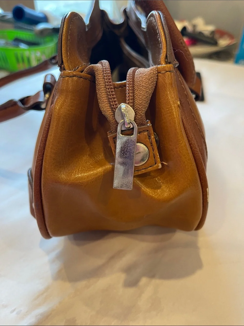 Rina Rich Brown and Tan Leather and vinyl Handbag Label View